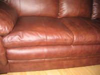 Repaired leather sofa